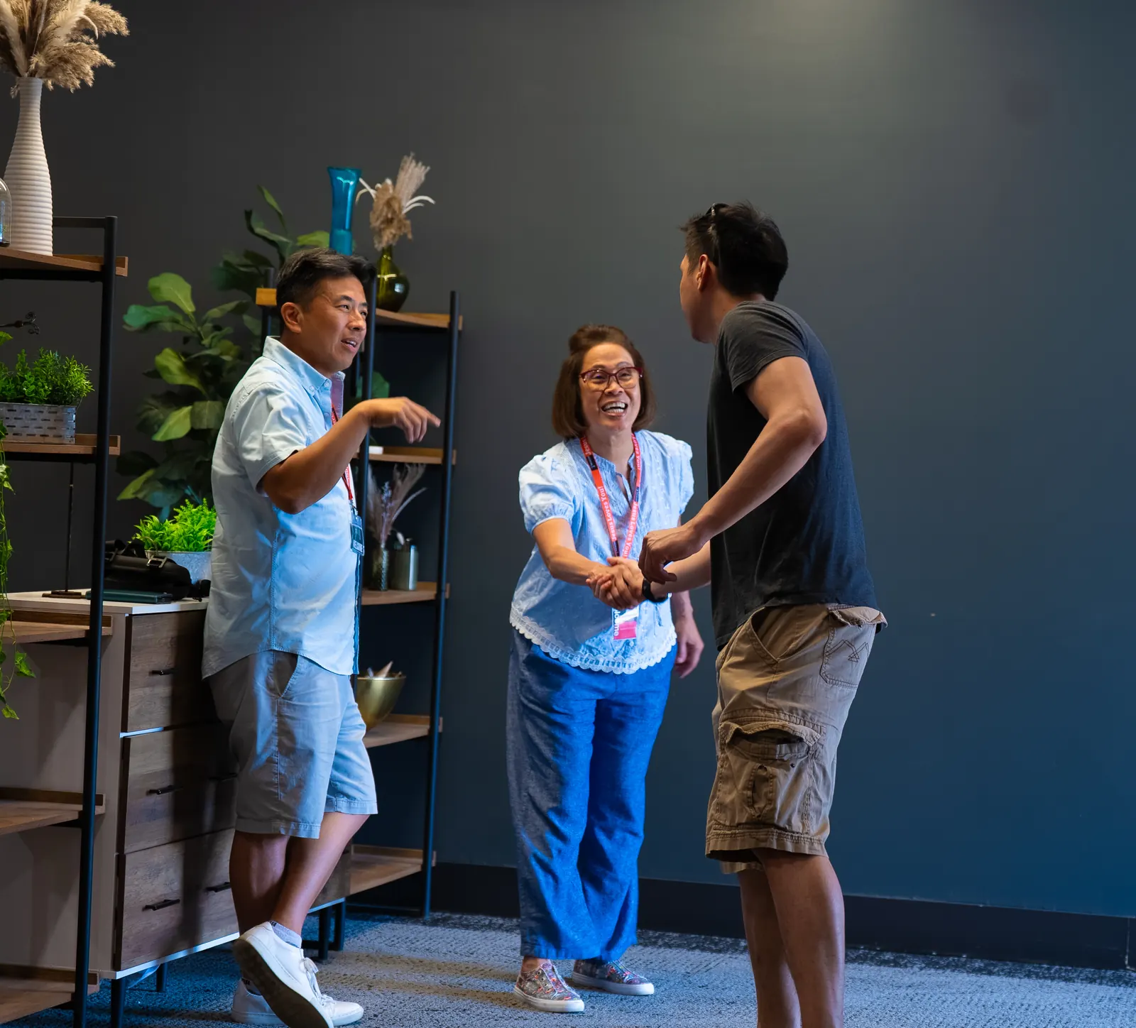 Beacon volunteers welcoming someone to church